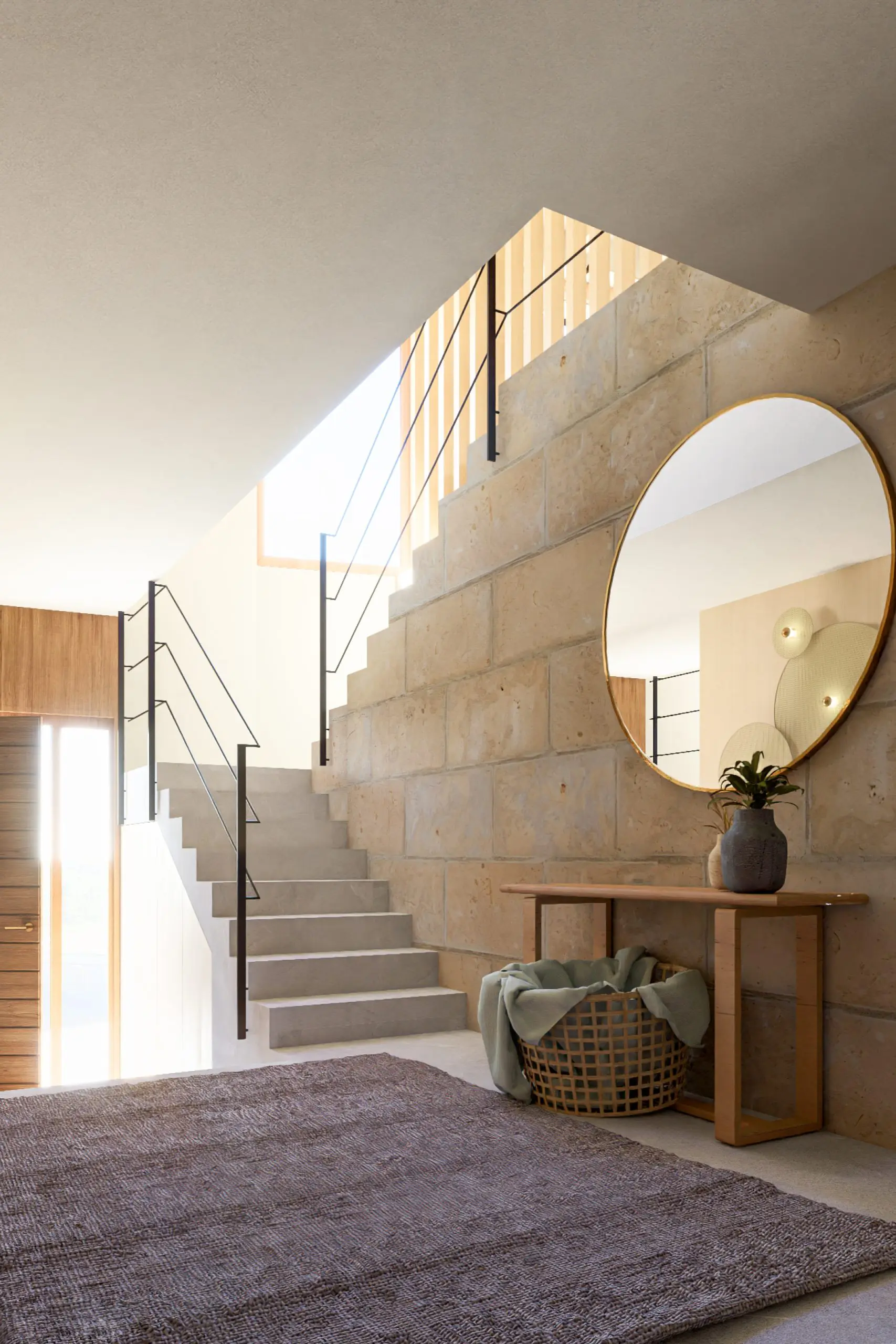 Modern stone staircase to first floor with large circle mirror on side of staircase